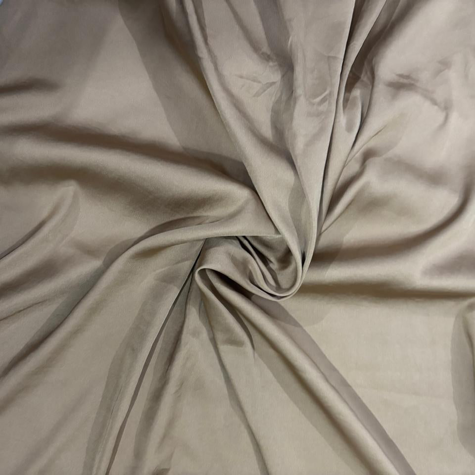A close-up of draped matte fold hijab with soft folds and a satin-like sheen