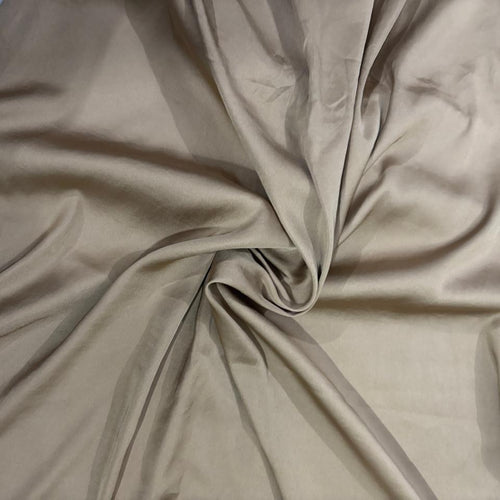 A close-up of draped matte fold hijab with soft folds and a satin-like sheen